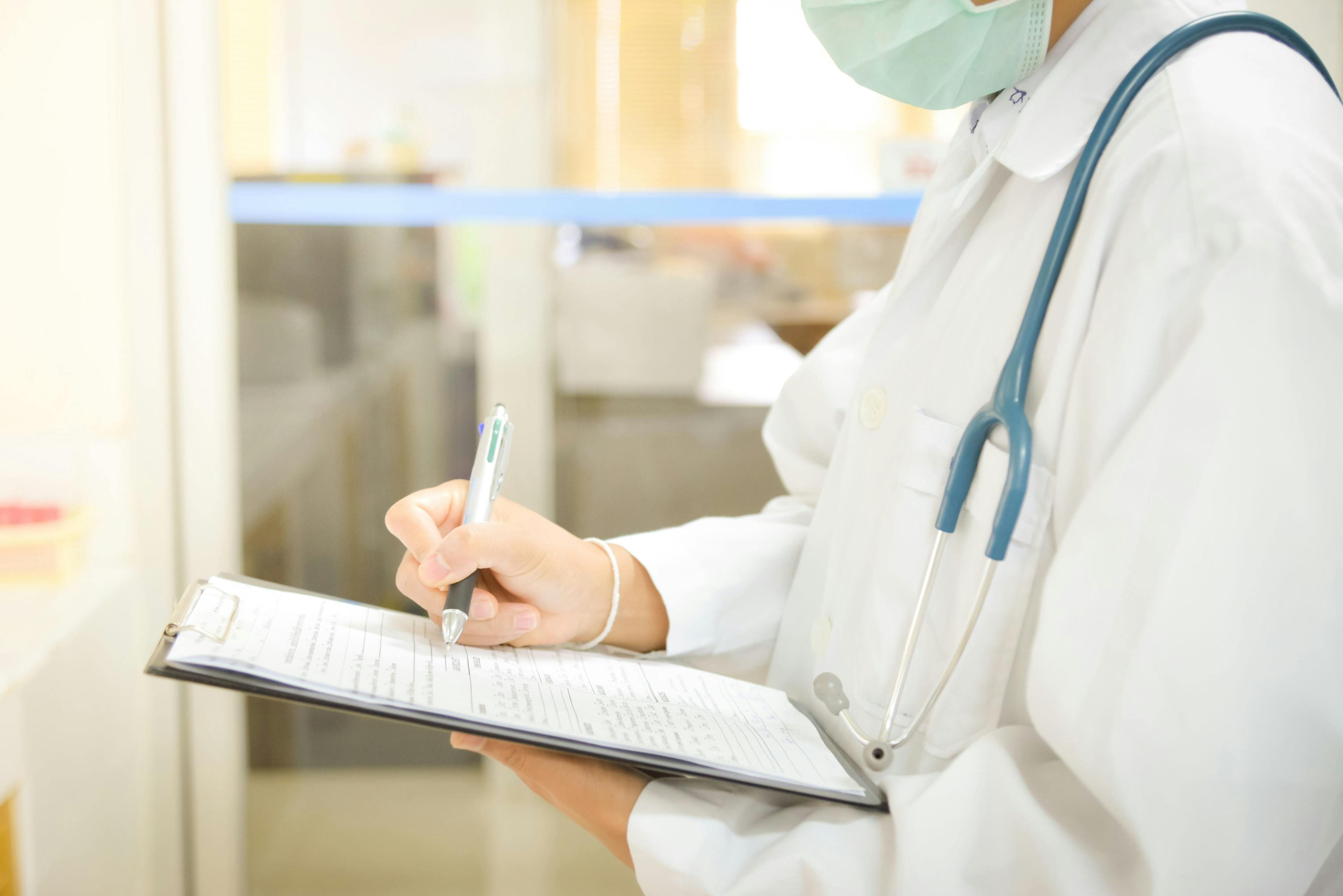 Clinician Taking Notes on Clinical Trial Concept | image credit: toeytoey - stock.adobe.come